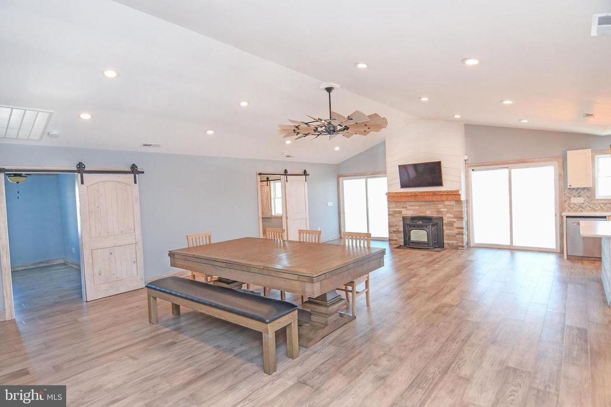 Dining room, Fireplace, Interior, Pendant Lights, Recessed Lighting, Wood Texture Flooring