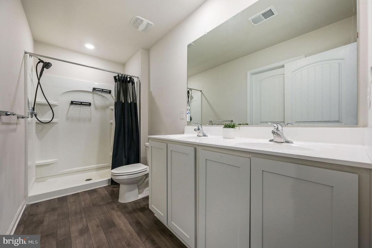 Bathroom, Dual Sink Vanities, Interior, Recessed Lighting, Wood Texture Flooring