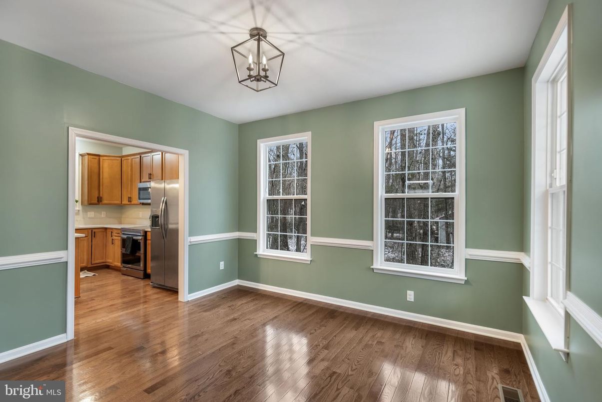Empty room, Interior, Kitchen, Pendant Lights, Stainless Steel Appliances, Wood Texture Flooring