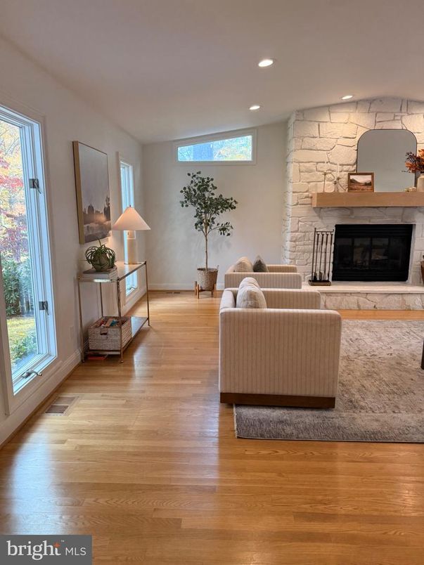 Fireplace, Interior, Living room, Recessed Lighting, Stone Walls, Wood Texture Flooring