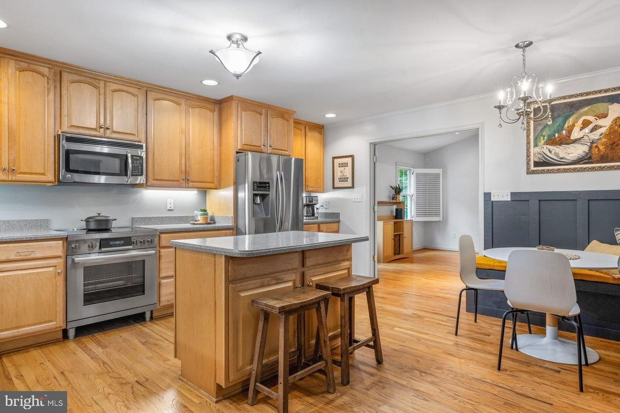 Chandelier, Dining room, Interior, Kitchen, Recessed Lighting, Stainless Steel Appliances, Wood Texture Flooring