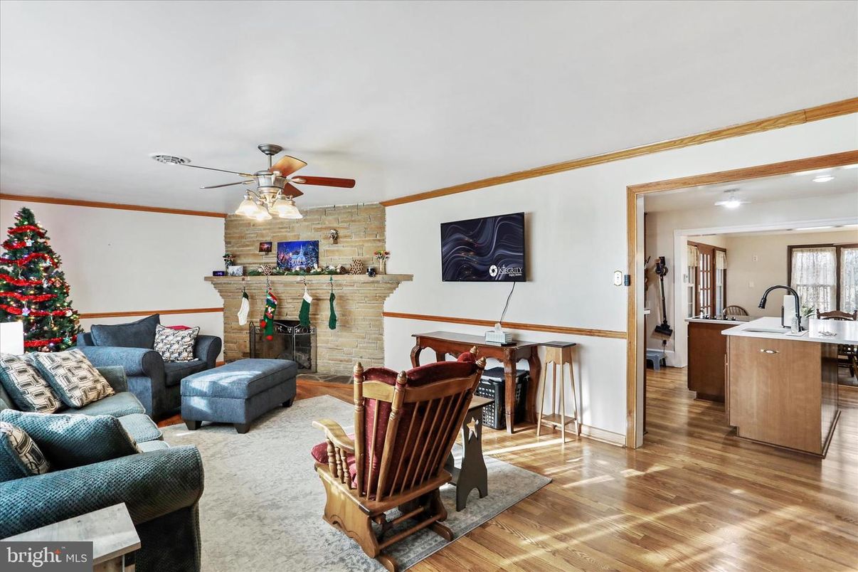 Dining room, Fireplace, Interior, Living room, Recessed Lighting, Stone Walls, Wood Texture Flooring