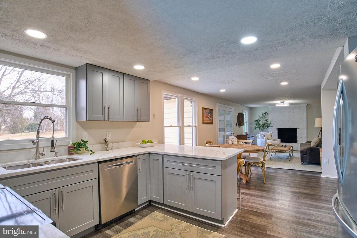 Dining room, Fireplace, Interior, Kitchen, Living room, Recessed Lighting, Stainless Steel Appliances, Wood Texture Flooring