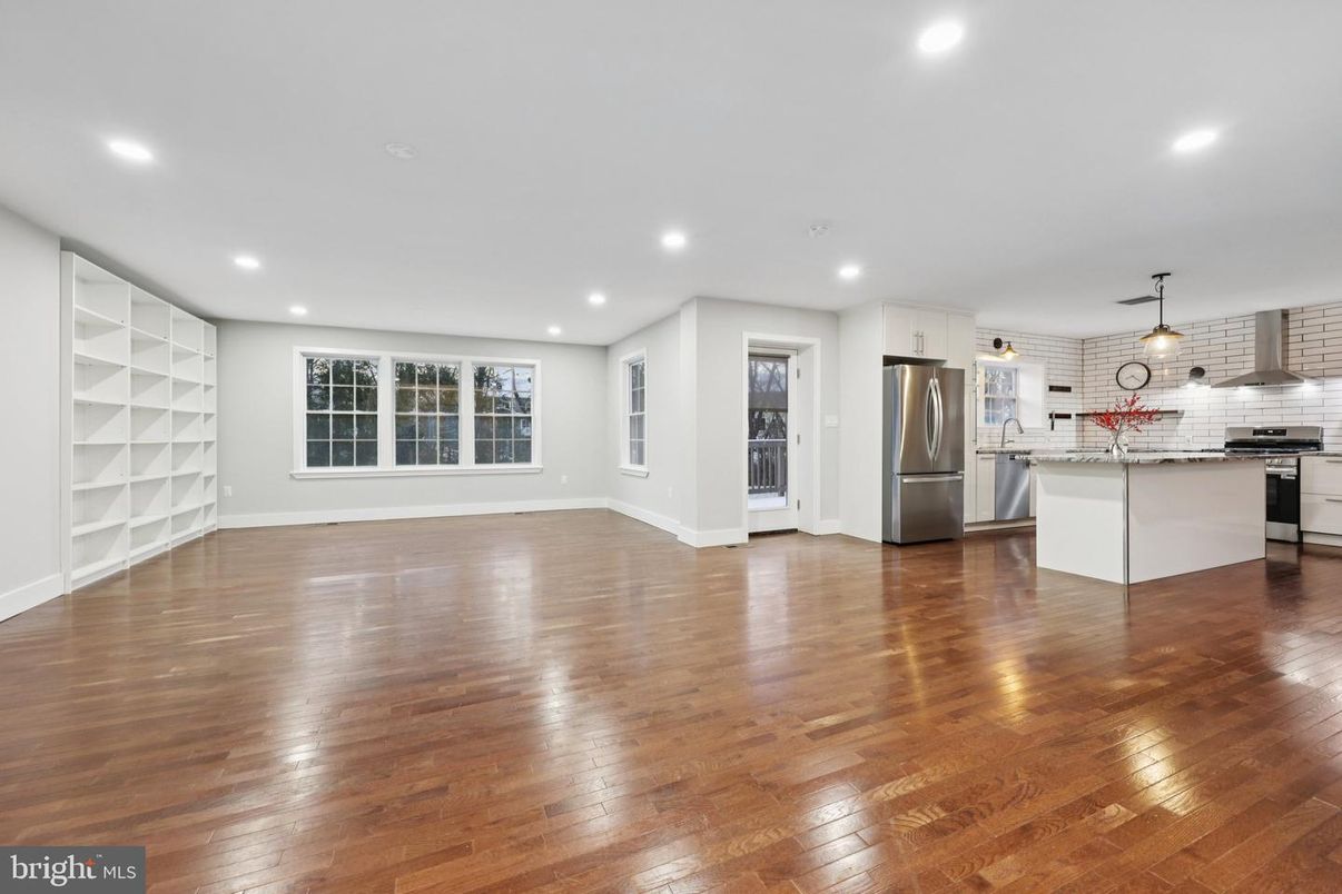 Empty room, Interior, Kitchen, Pendant Lights, Recessed Lighting, Stainless Steel Appliances, Wood Texture Flooring