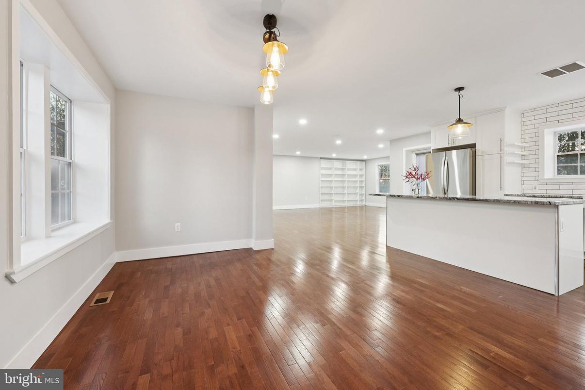 Empty room, Interior, Kitchen, Pendant Lights, Recessed Lighting, Stainless Steel Appliances, Wood Texture Flooring