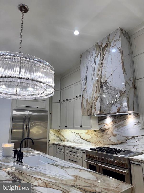 Interior, Kitchen, Marble Walls, Recessed Lighting, Stainless Steel Appliances