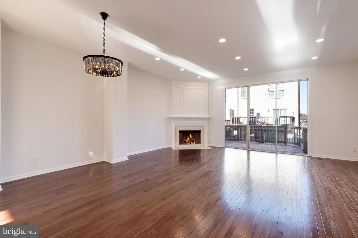 Chandelier, Empty room, Fireplace, Interior, Recessed Lighting, Wood Texture Flooring
