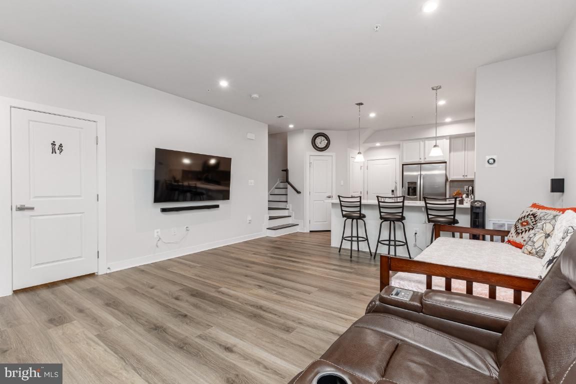 Dining room, Interior, Kitchen, Pendant Lights, Recessed Lighting, Stainless Steel Appliances, Wood Texture Flooring