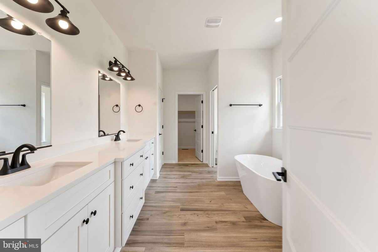 Bathroom, Dual Sink Vanities, Free Standing Baths, Interior, Recessed Lighting, Wood Texture Flooring