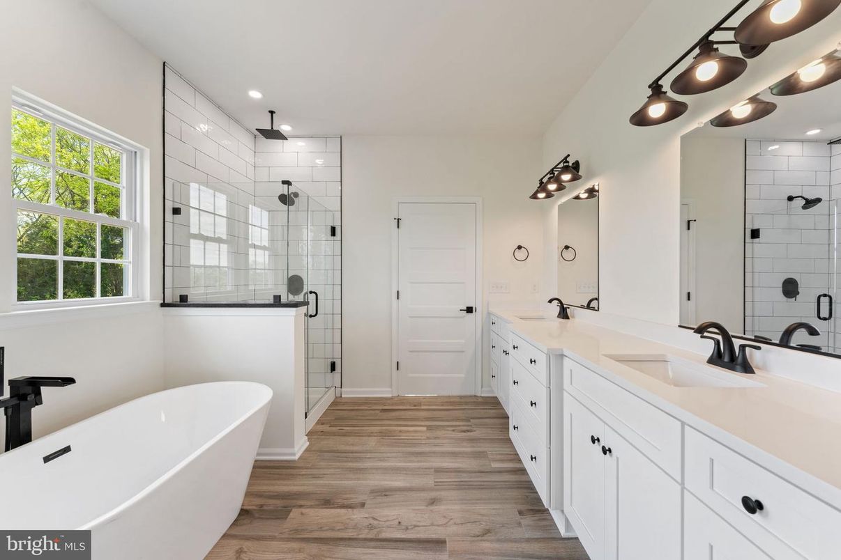 Bathroom, Dual Sink Vanities, Free Standing Baths, Glass Shower, Interior, Recessed Lighting, Wood Texture Flooring