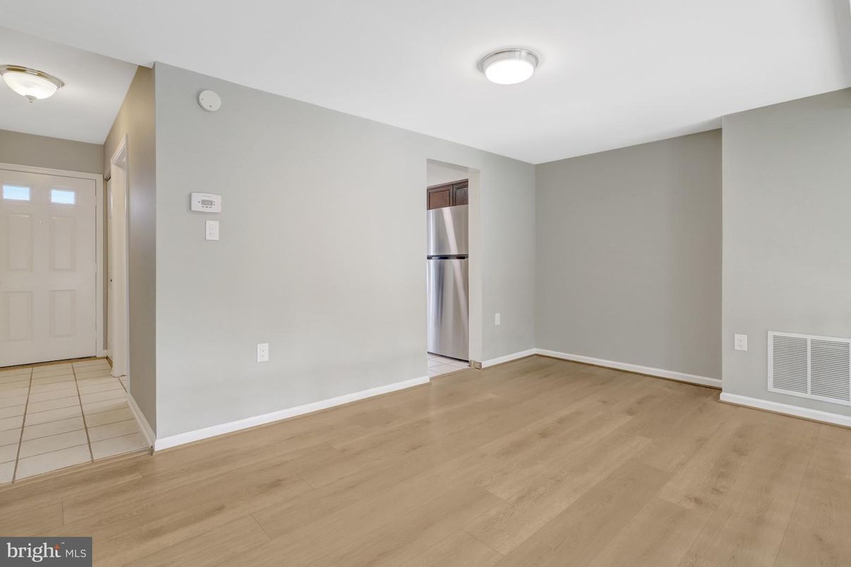 Empty room, Interior, Kitchen, Stainless Steel Appliances, Wood Texture Flooring