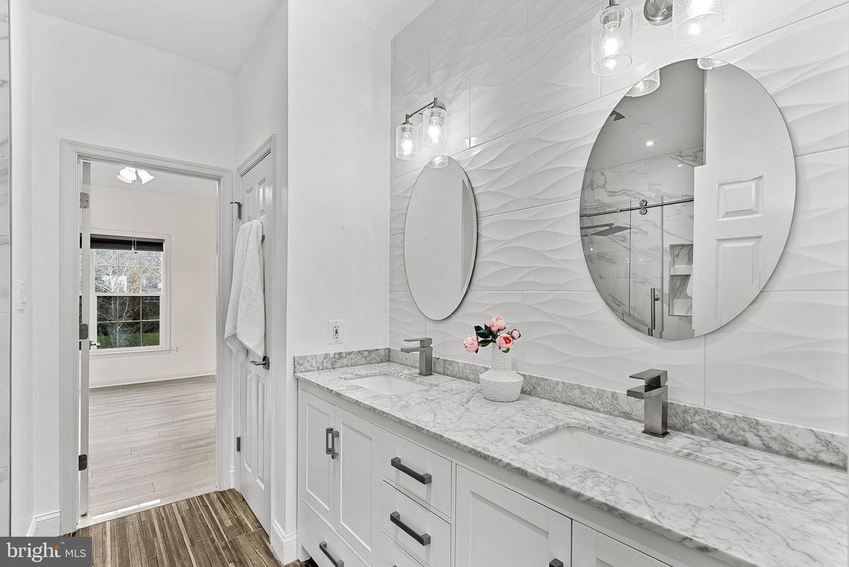 Bathroom, Dual Sink Vanities, Interior, Marble Walls, Wood Texture Flooring
