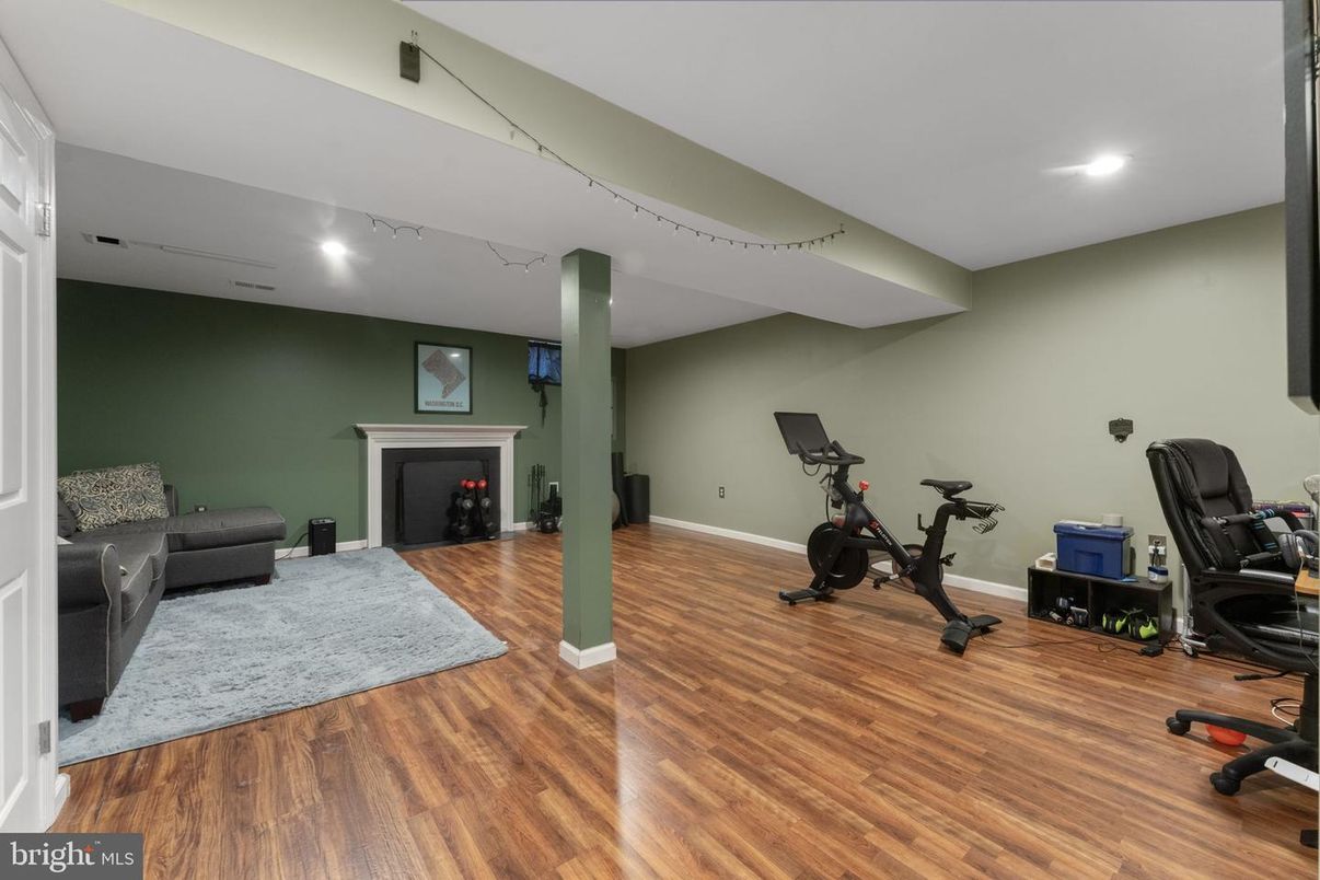 Fireplace, Fitness Equipment, Interior, Recessed Lighting, Wood Texture Flooring