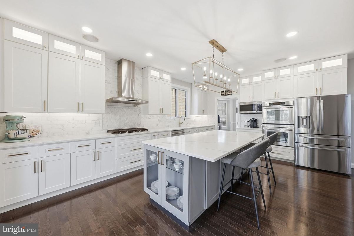 Interior, Kitchen, Marble Walls, Pendant Lights, Recessed Lighting, Stainless Steel Appliances, Wood Texture Flooring