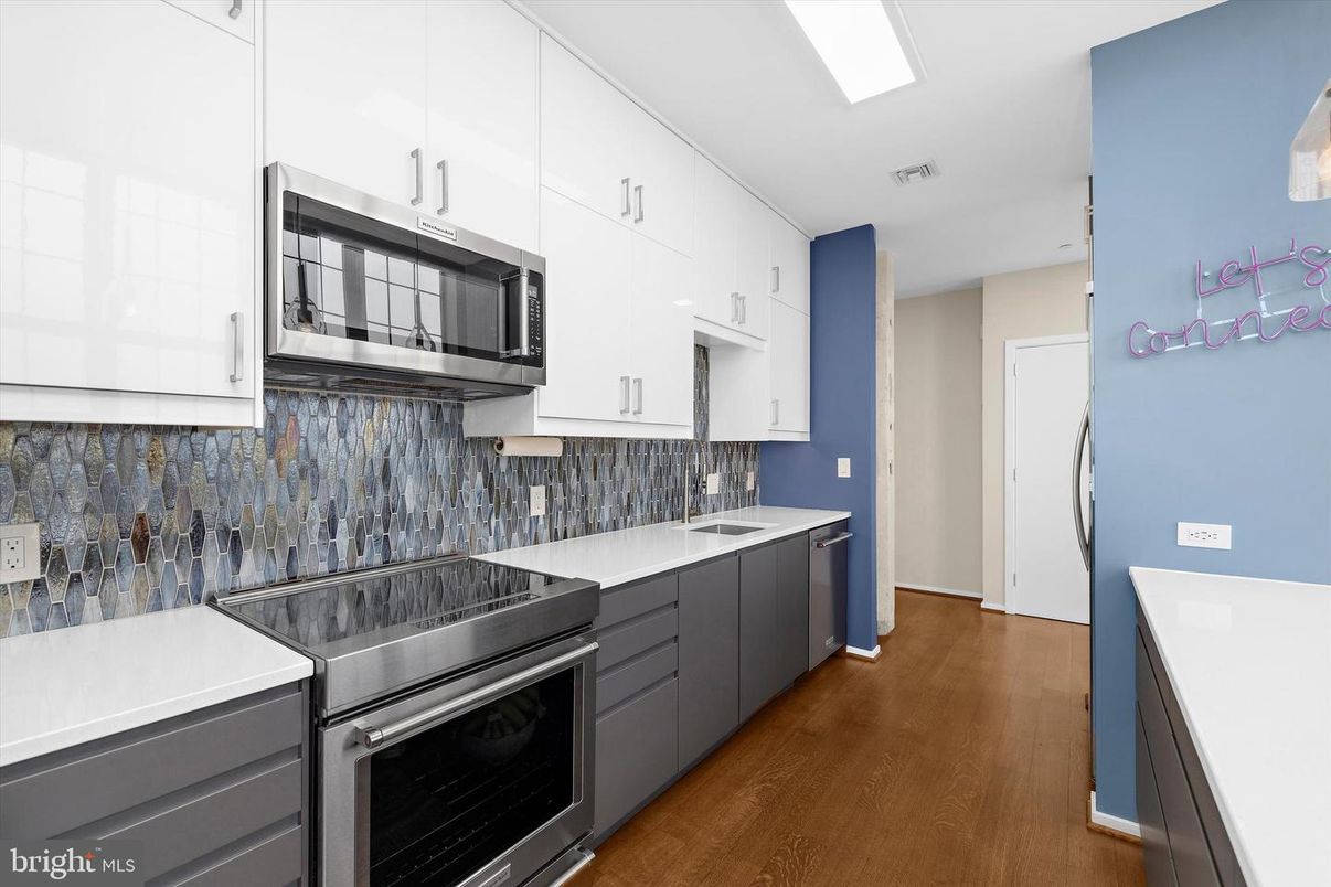 Interior, Kitchen, Recessed Lighting, Stainless Steel Appliances, Washer, Wood Texture Flooring