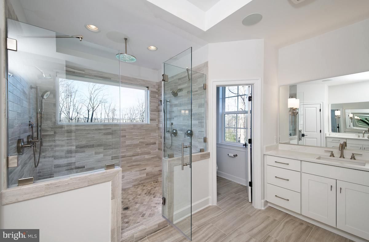 Bathroom, Dual Sink Vanities, Glass Shower, Interior, Recessed Lighting, Wood Texture Flooring