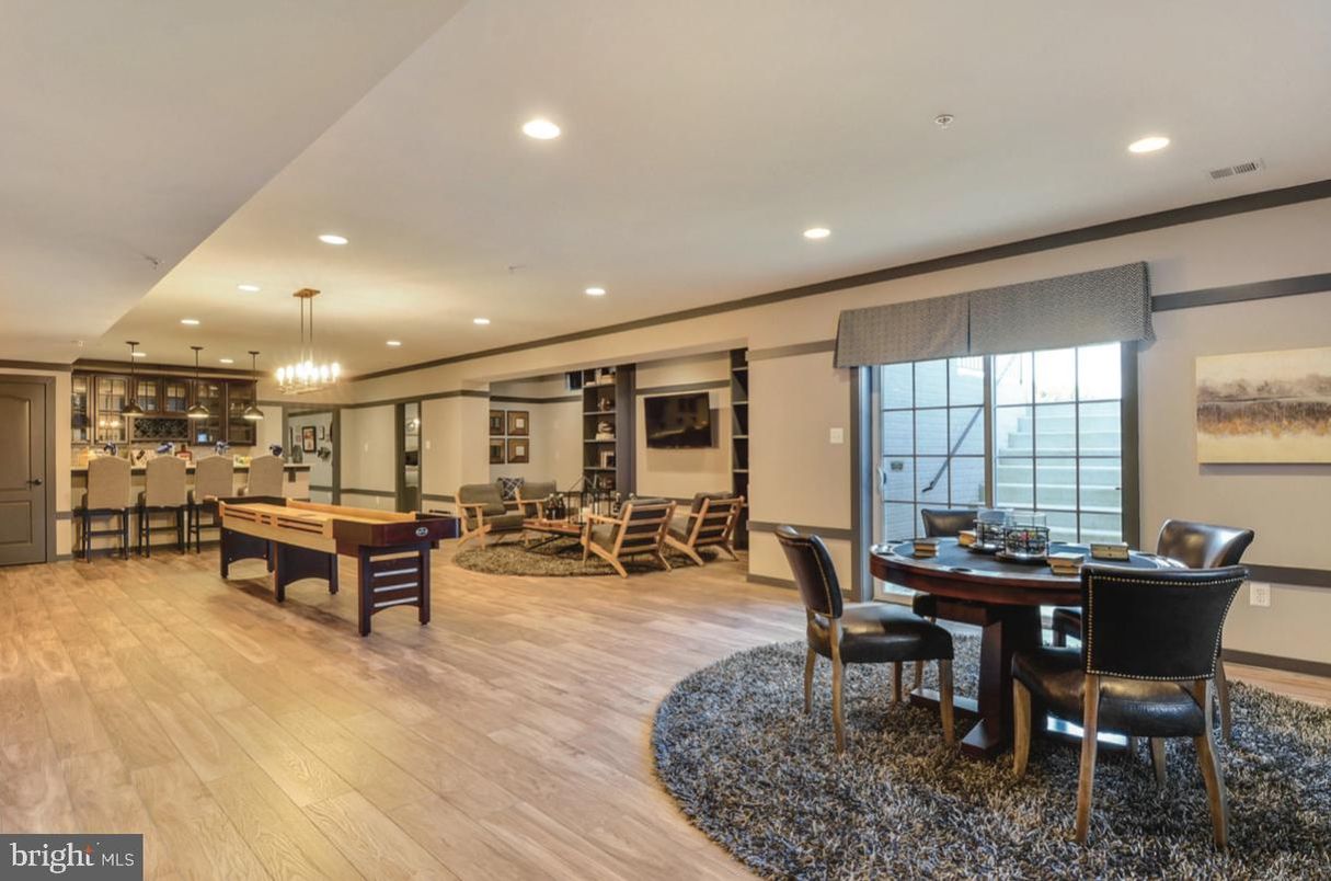 Billiard Table, Chandelier, Dining room, Game Room, Interior, Living room, Pendant Lights, Recessed Lighting, Wood Texture Flooring