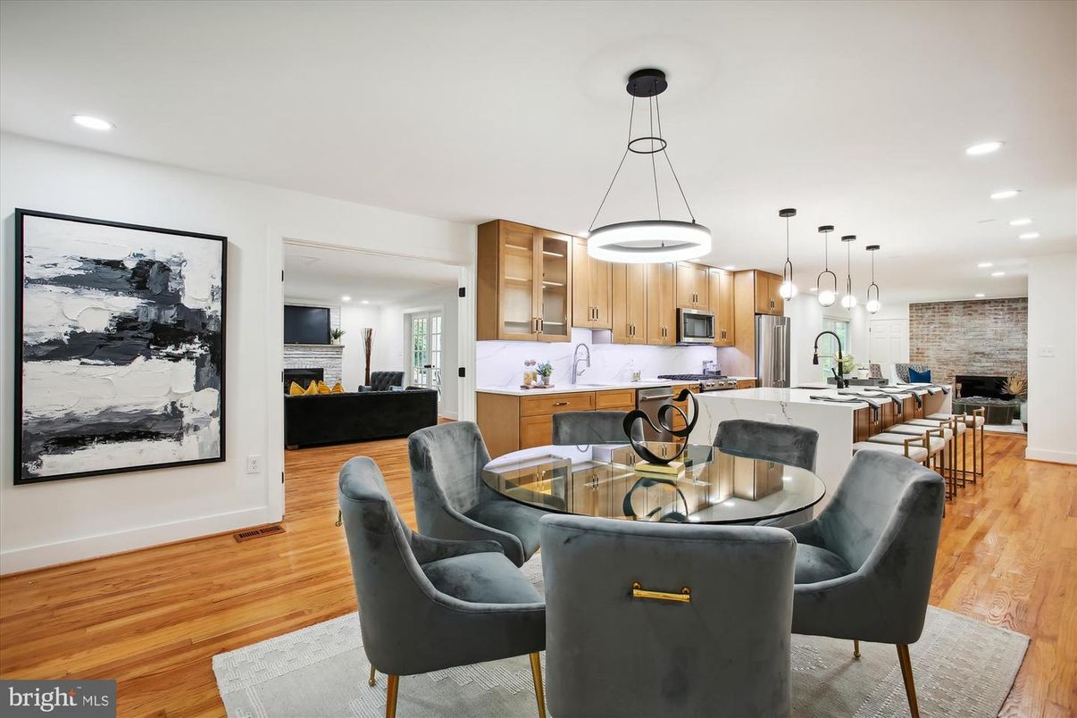 Dining room, Fireplace, Interior, Kitchen, Living room, Pendant Lights, Recessed Lighting, Stainless Steel Appliances, Stone Walls, Wood Texture Flooring