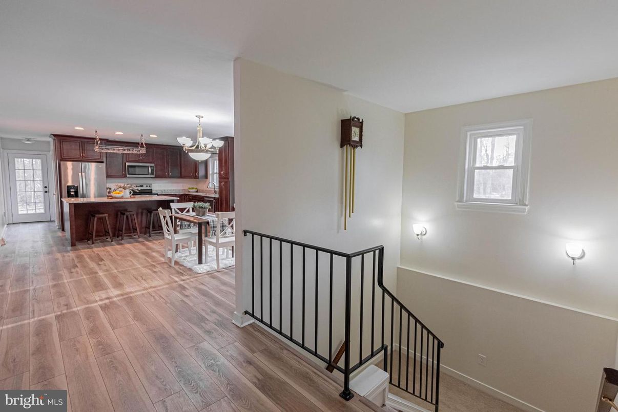 Chandelier, Dining room, Interior, Kitchen, Recessed Lighting, Stainless Steel Appliances, Wood Texture Flooring