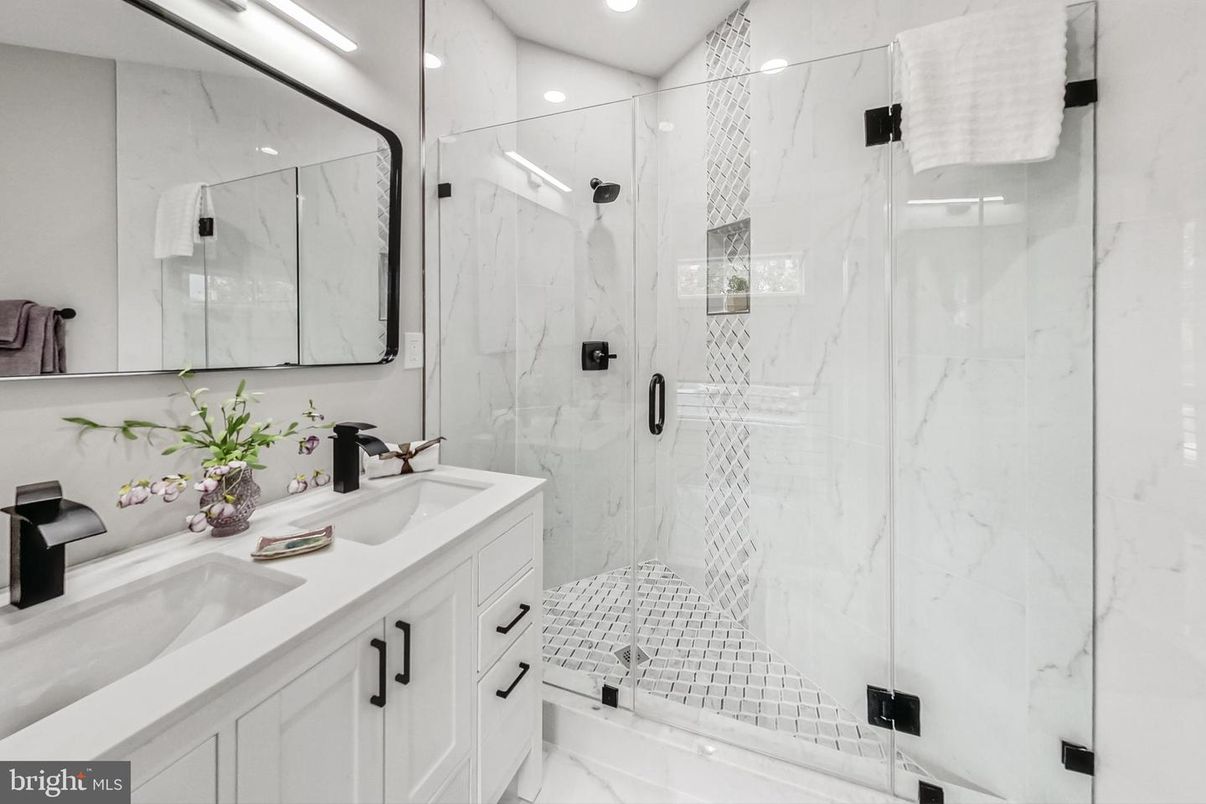 Bathroom, Dual Sink Vanities, Glass Shower, Interior, Marble Walls, Recessed Lighting