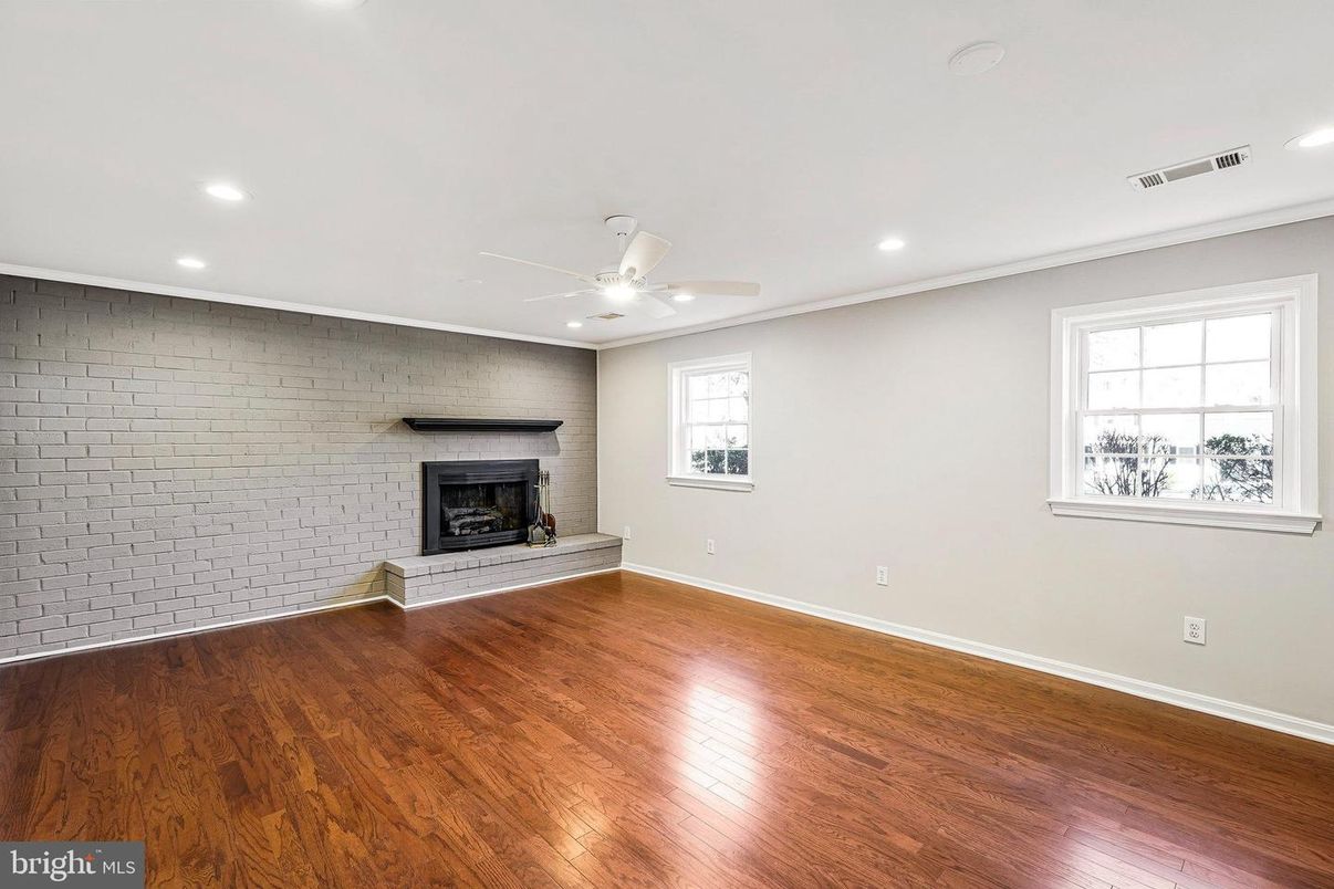 Empty room, Fireplace, Interior, Recessed Lighting, Stone Walls, Wood Texture Flooring
