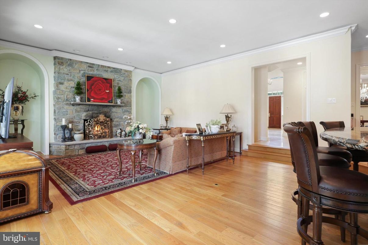 Fireplace, Interior, Living room, Recessed Lighting, Stone Walls, Wood Texture Flooring