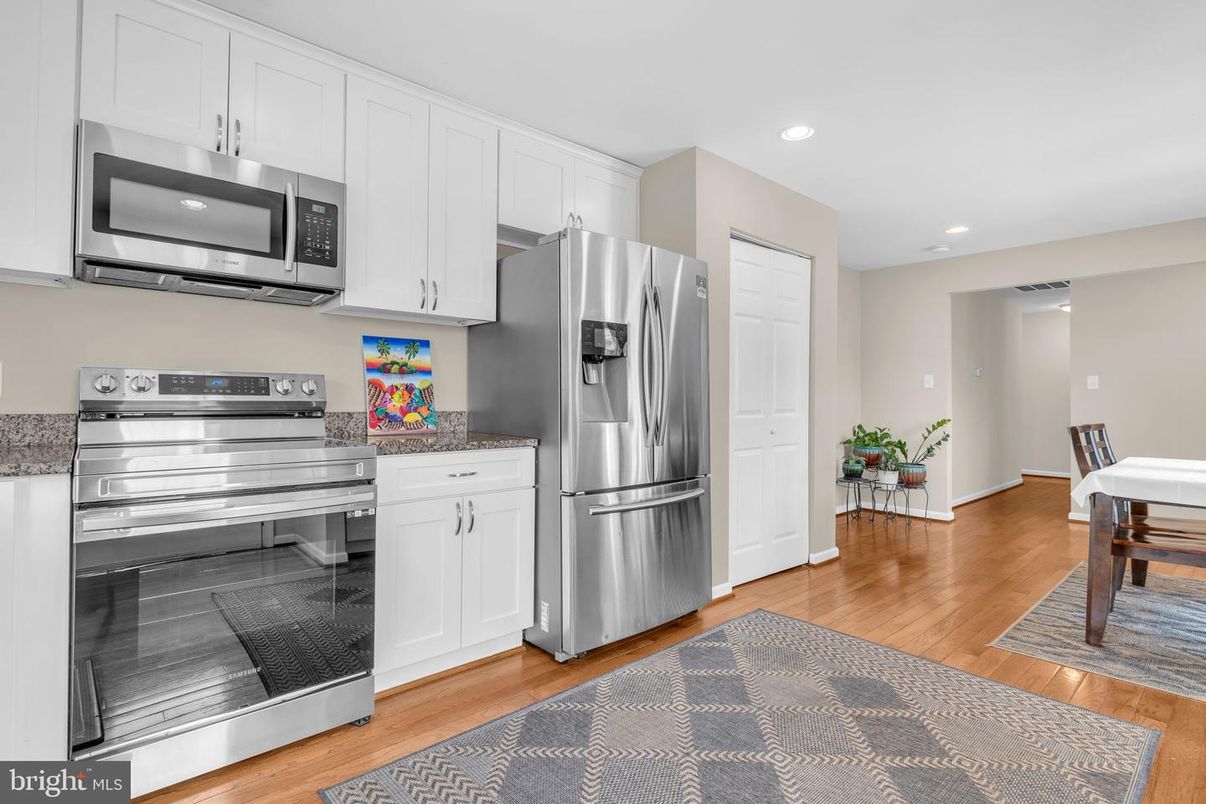Dining room, Interior, Kitchen, Recessed Lighting, Stainless Steel Appliances, Wood Texture Flooring