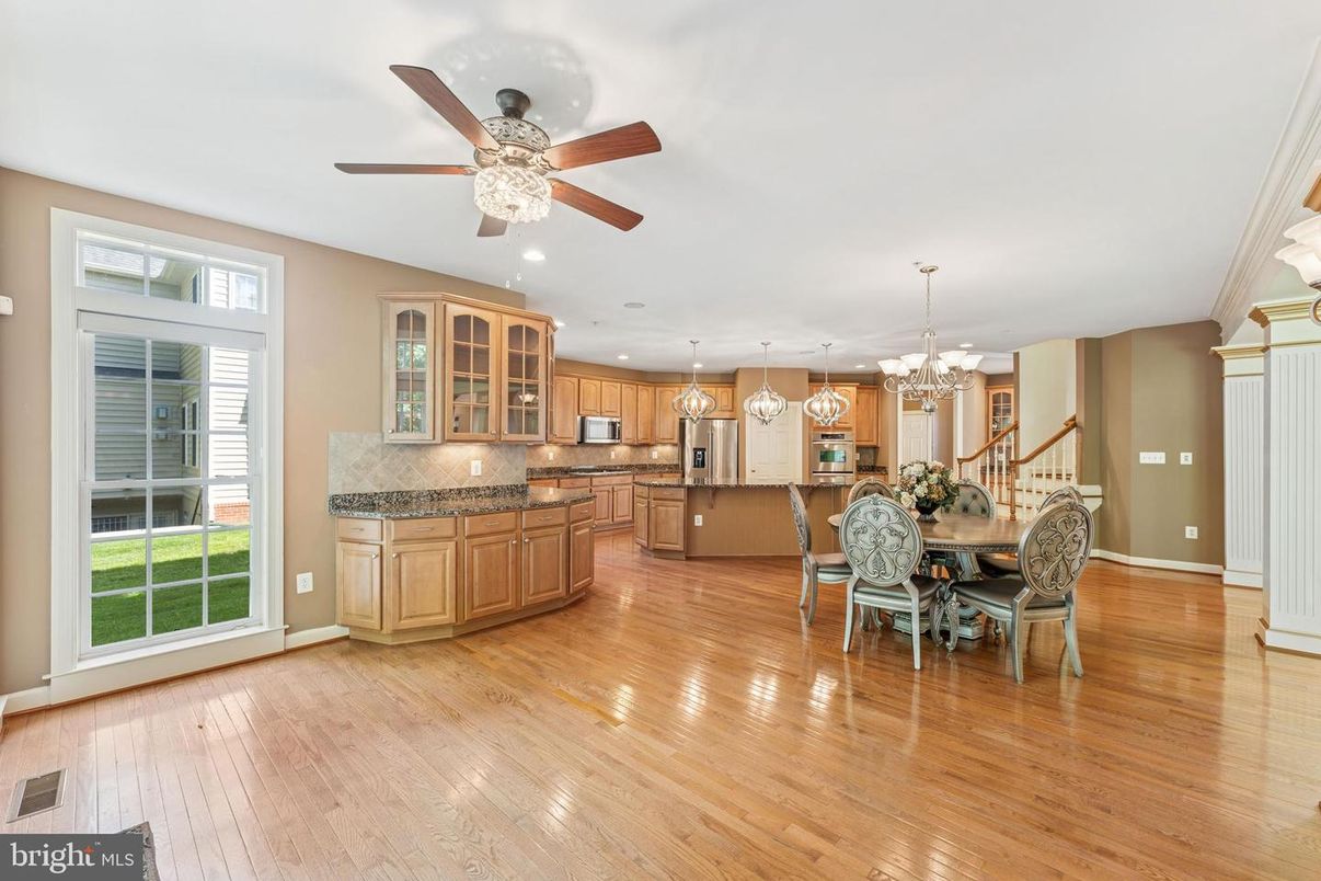 Chandelier, Dining room, Interior, Kitchen, Pendant Lights, Recessed Lighting, Stainless Steel Appliances, Wood Texture Flooring