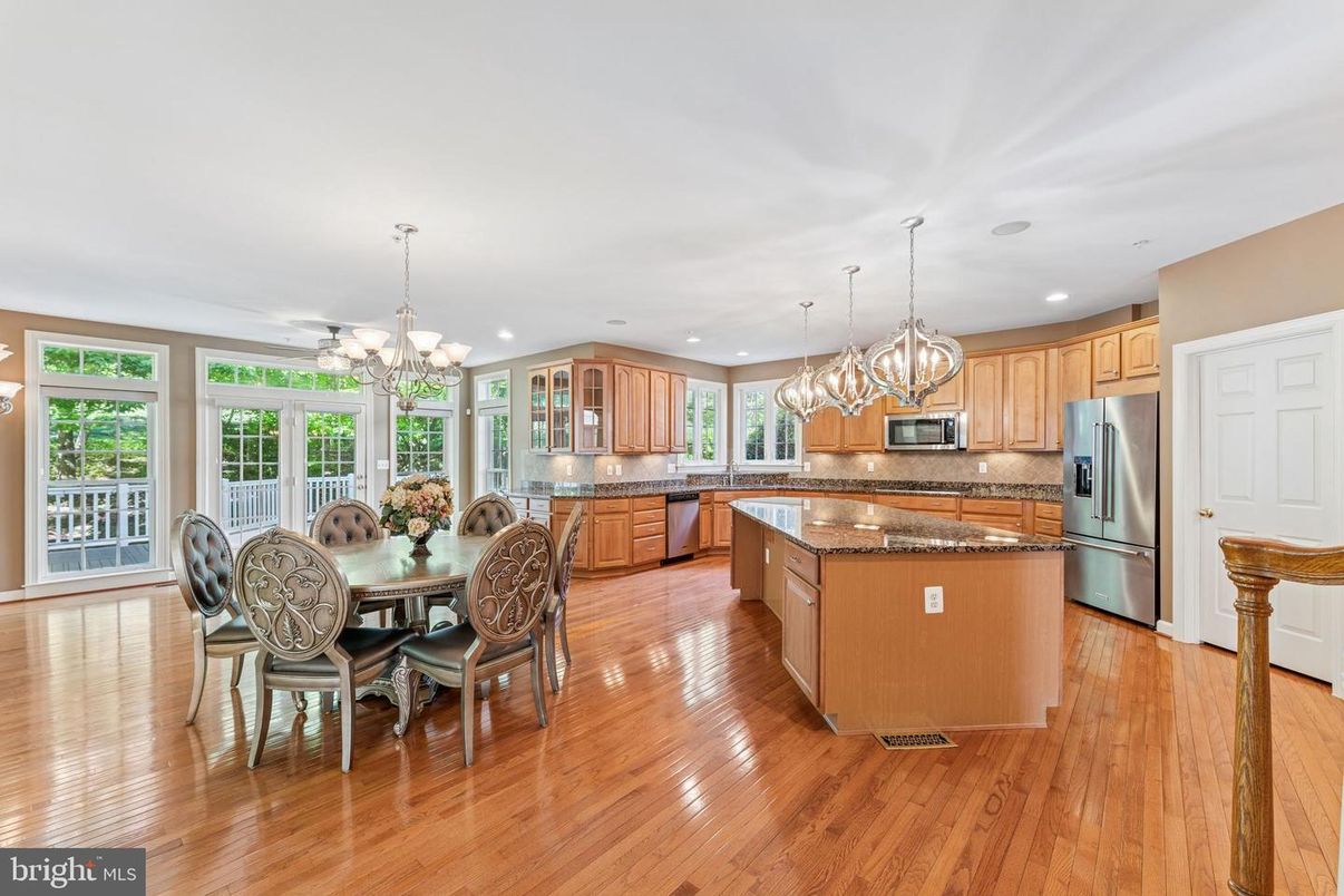 Chandelier, Dining room, Interior, Kitchen, Pendant Lights, Recessed Lighting, Stainless Steel Appliances, Wood Texture Flooring