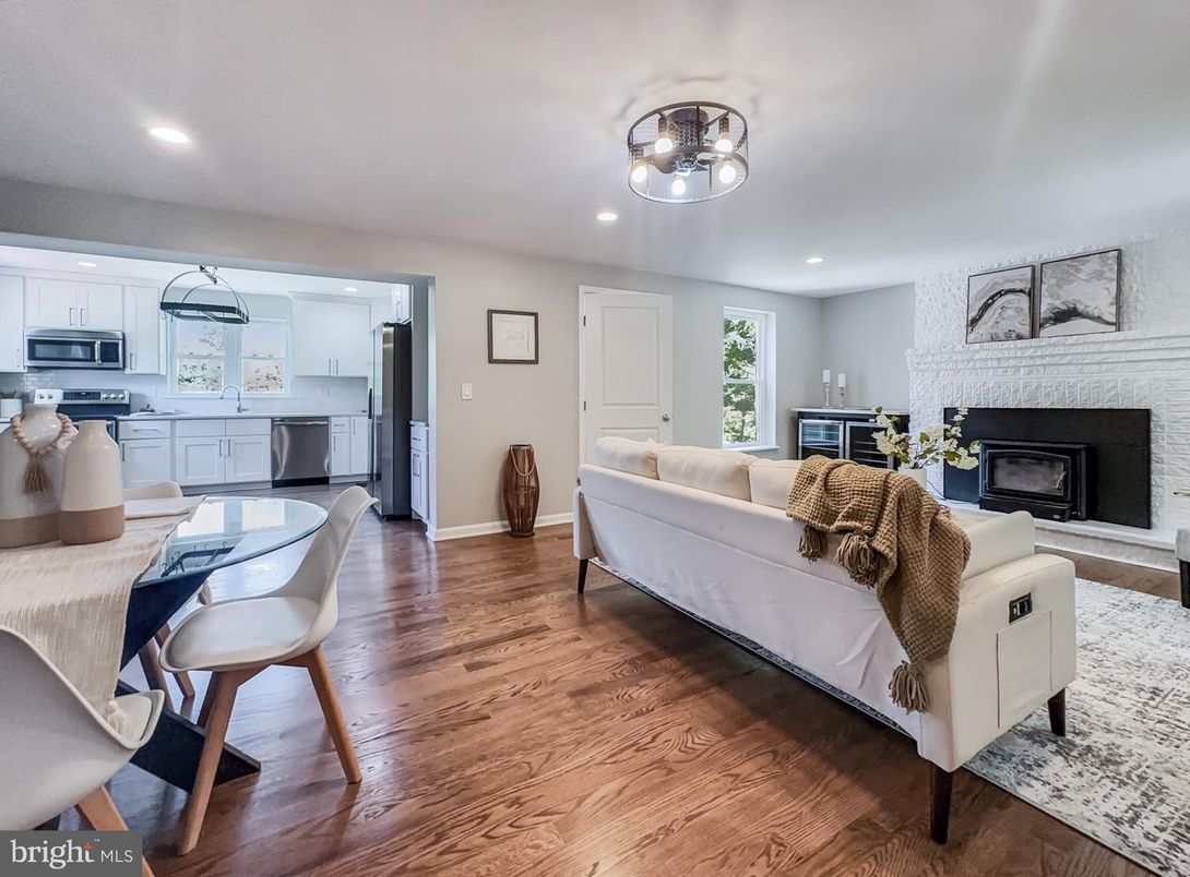 Dining room, Fireplace, Interior, Kitchen, Living room, Recessed Lighting, Stainless Steel Appliances, Wood Texture Flooring