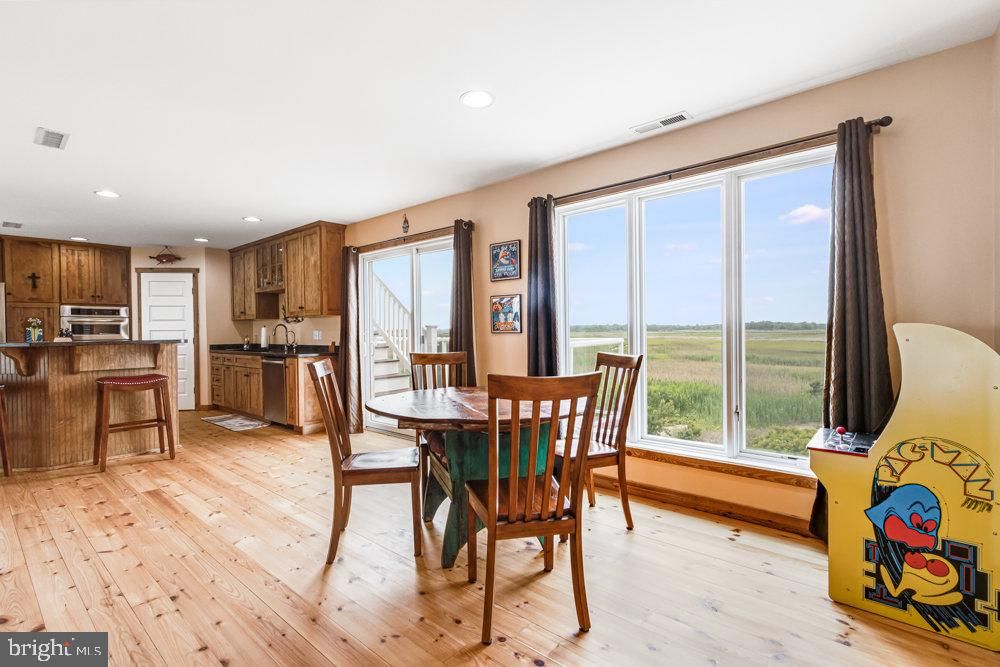 Dining room, Interior, Kitchen, Recessed Lighting, Stainless Steel Appliances, Wood Texture Flooring