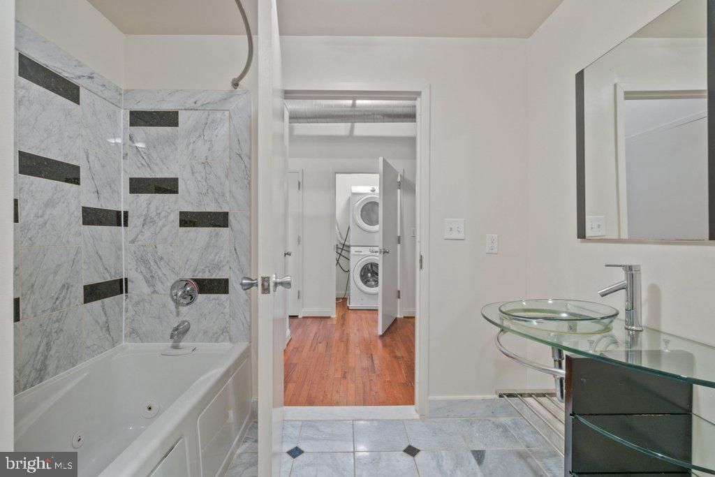 Bathroom, Interior, Marble Walls, Utility Closets, Washer, Wood Texture Flooring