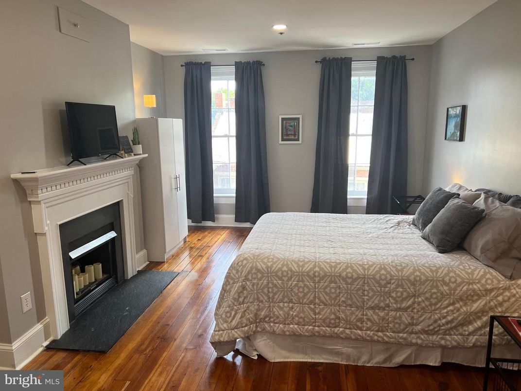 Bedroom, Fireplace, Interior, Recessed Lighting, Wood Texture Flooring