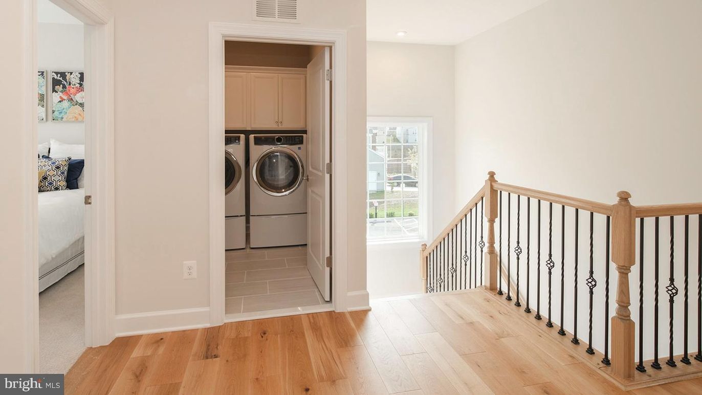 Bedroom, Interior, Recessed Lighting, Utility Closets, Washer, Wood Texture Flooring