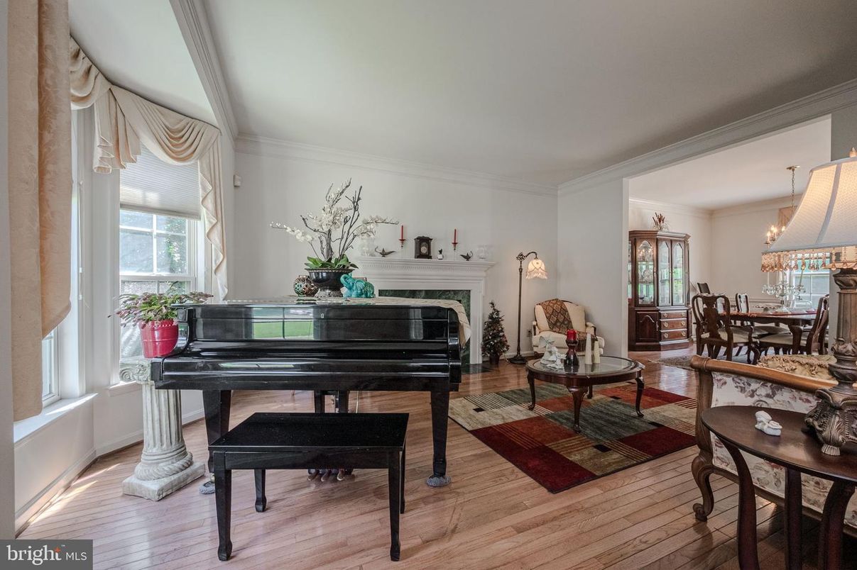 Chandelier, Dining room, Fireplace, Interior, Living room, Piano, Wood Texture Flooring