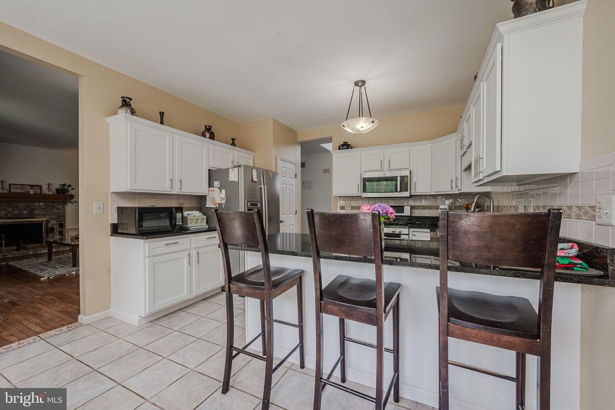 Dining room, Fireplace, Interior, Kitchen, Pendant Lights, Wood Texture Flooring