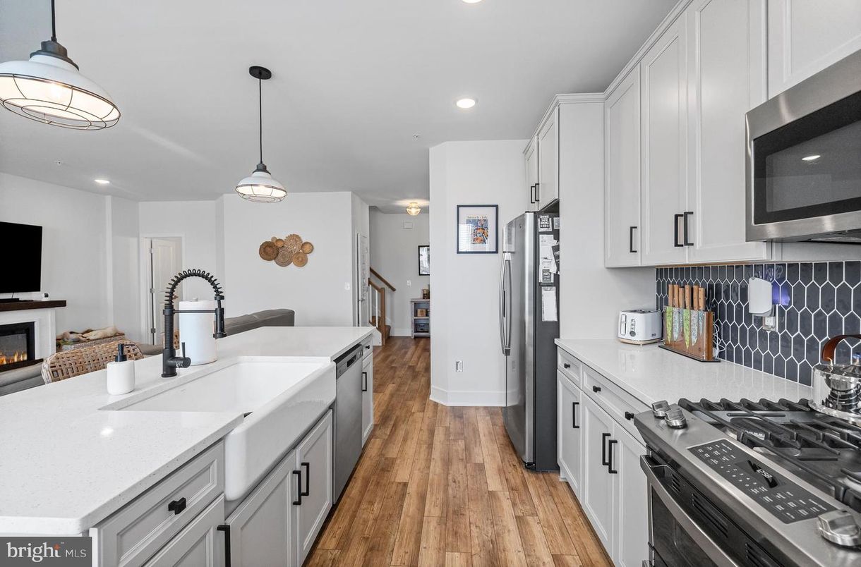 Fireplace, Interior, Kitchen, Pendant Lights, Recessed Lighting, Stainless Steel Appliances, Wood Texture Flooring