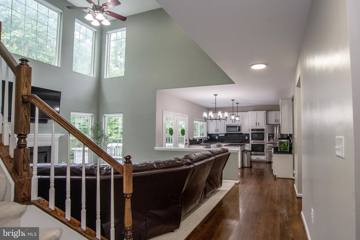 Chandelier, Interior, Kitchen, Living room, Recessed Lighting, Stainless Steel Appliances, Wood Texture Flooring