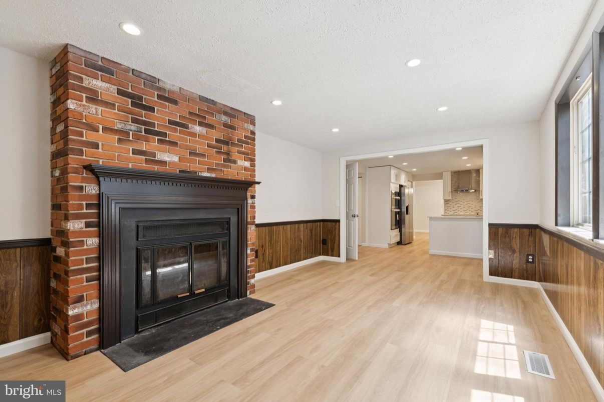 Empty room, Fireplace, Interior, Kitchen, Recessed Lighting, Wood Texture Flooring