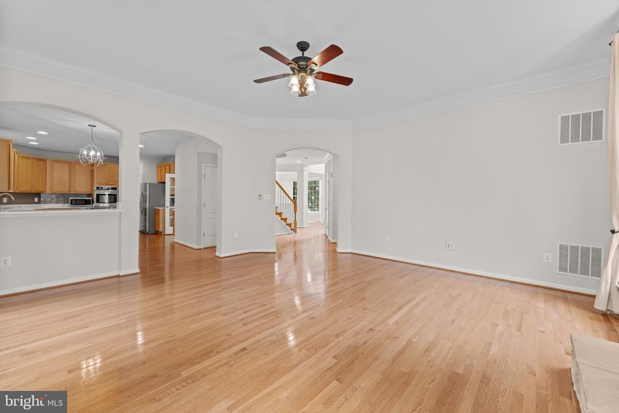 Chandelier, Empty room, Interior, Kitchen, Recessed Lighting, Stainless Steel Appliances, Wood Texture Flooring