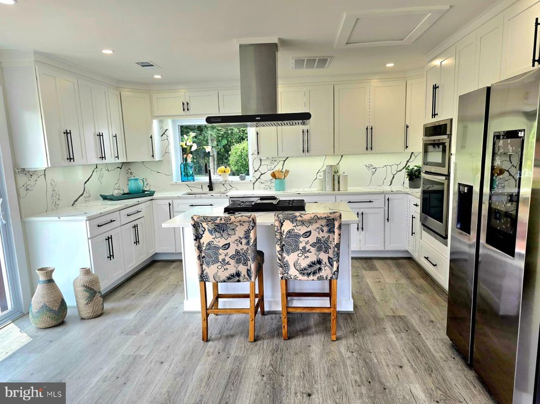 Interior, Kitchen, Marble Walls, Recessed Lighting, Stainless Steel Appliances, Wood Texture Flooring