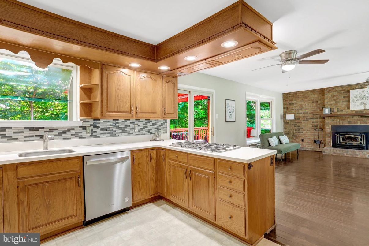 Fireplace, Interior, Kitchen, Recessed Lighting, Stone Walls, Wood Texture Flooring