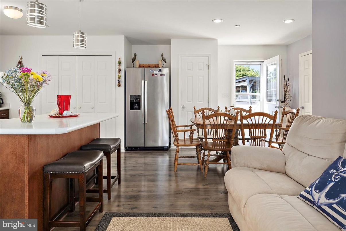 Dining room, Interior, Kitchen, Pendant Lights, Recessed Lighting, Stainless Steel Appliances, Wood Texture Flooring