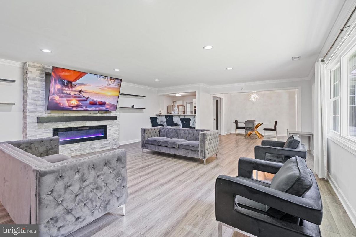 Dining room, Fireplace, Interior, Living room, Recessed Lighting, Wood Texture Flooring