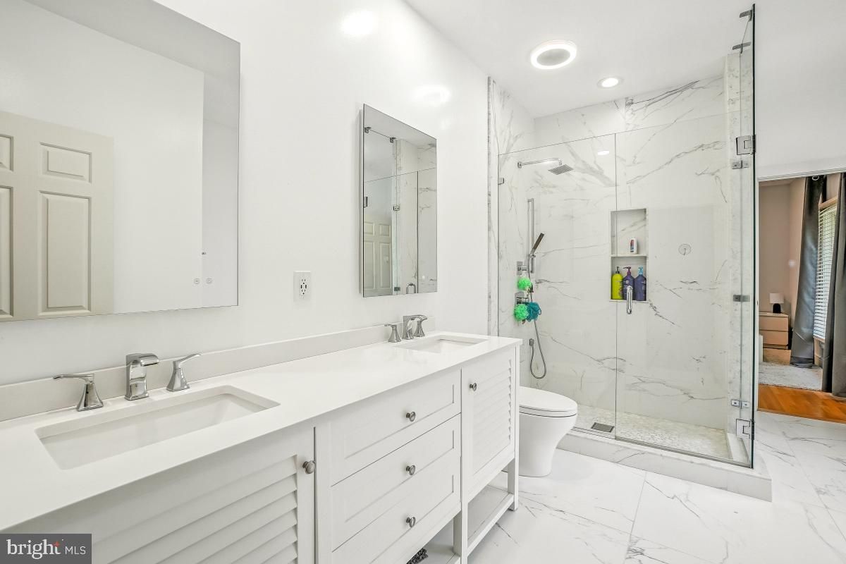 Bathroom, Dual Sink Vanities, Glass Shower, Interior, Marble, Marble Walls, Recessed Lighting