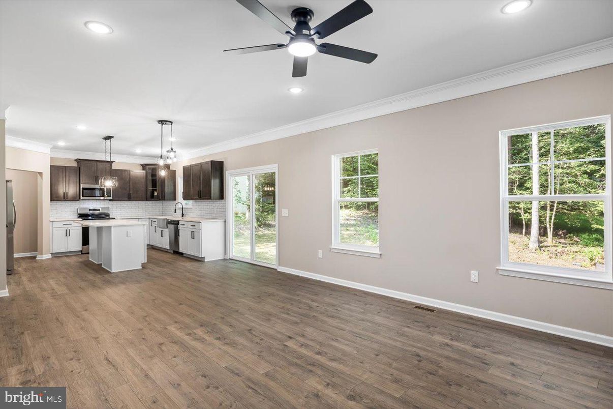 Empty room, Interior, Kitchen, Pendant Lights, Recessed Lighting, Stainless Steel Appliances, Wood Texture Flooring