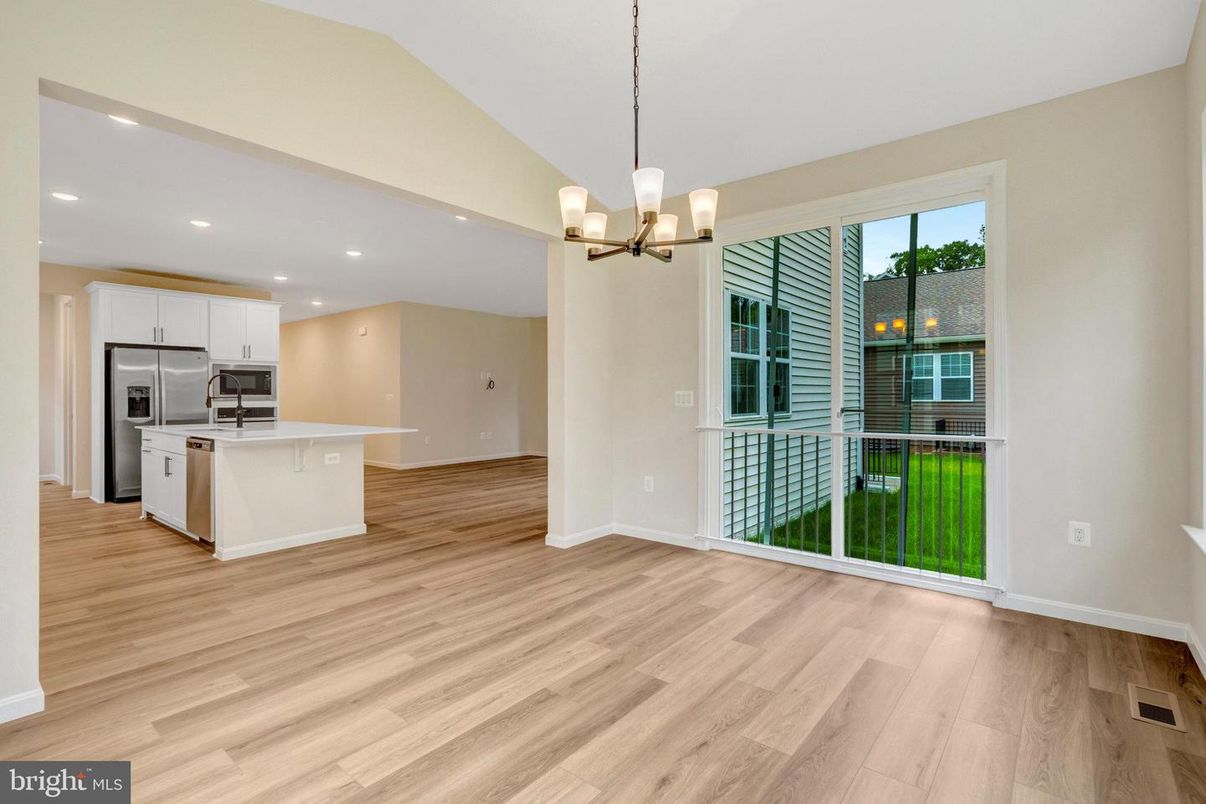 Chandelier, Empty room, Interior, Kitchen, Pendant Lights, Recessed Lighting, Stainless Steel Appliances, Wood Texture Flooring