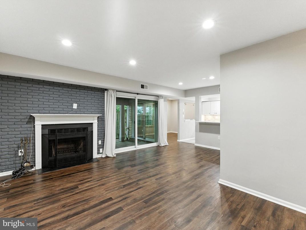 Empty room, Fireplace, Interior, Recessed Lighting, Stone Walls, Wood Texture Flooring