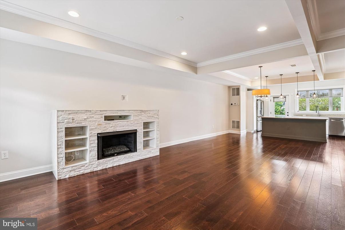 Empty room, Fireplace, Interior, Kitchen, Pendant Lights, Recessed Lighting, Wood Texture Flooring