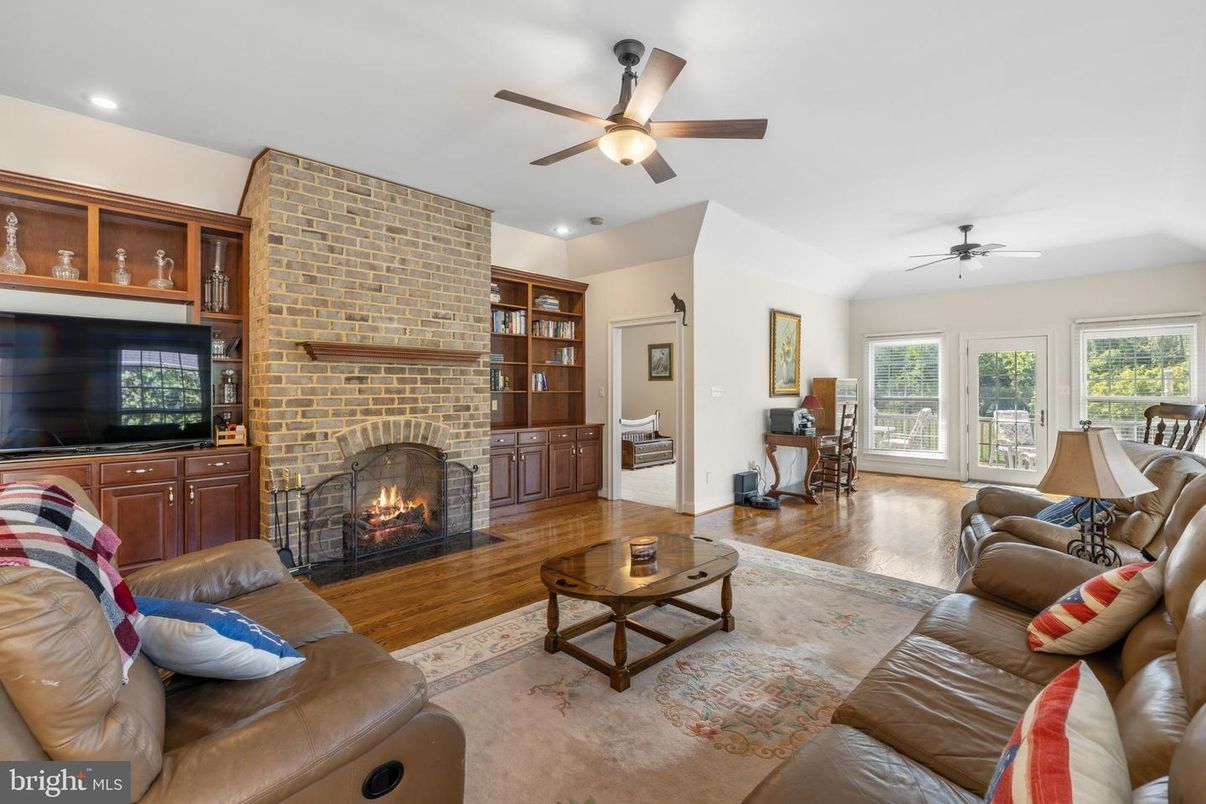 Fireplace, Interior, Living room, Recessed Lighting, Stone Walls, Wood Texture Flooring